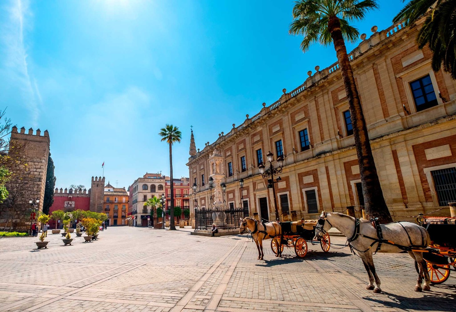 Quiet moment in Plaza del Triunfo, with the Alcázar and the Archive of the Indies